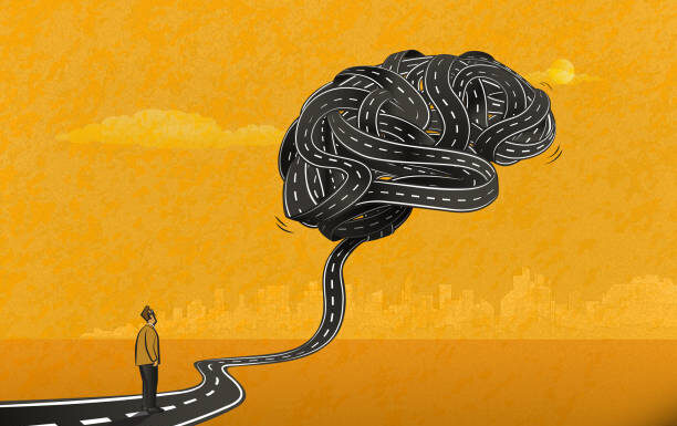 What are the 5 Physical Symptoms of Stress? The man standing on a road and looking at the big brain-shaped knot. Stress and its physical symptoms