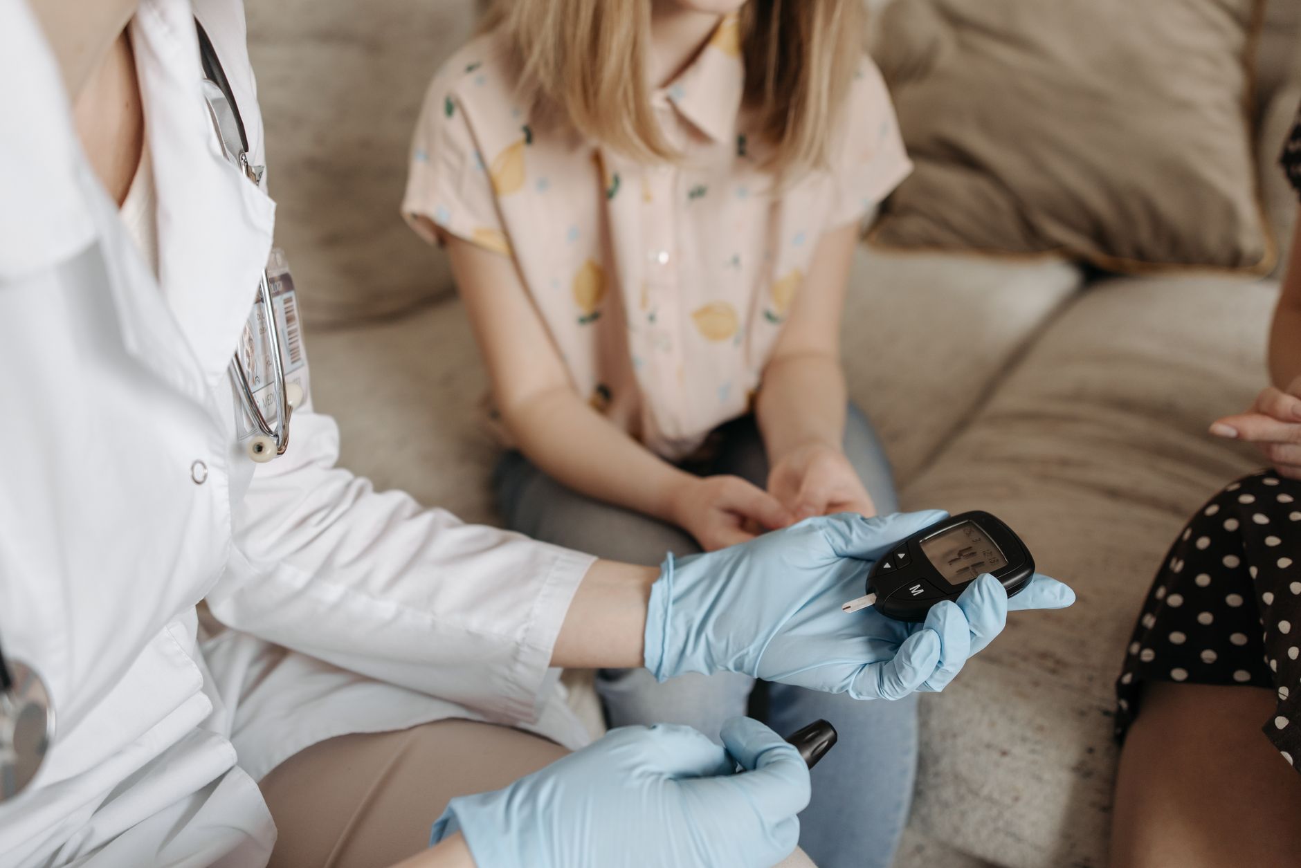 A healthcare professional checking blood pressure to monitor diabetes slow wound healing progress.