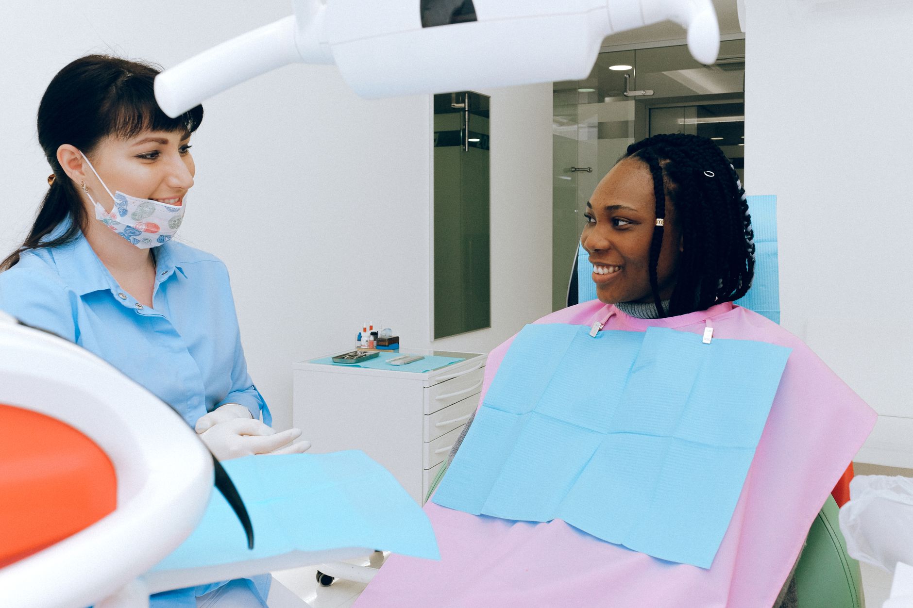 A patient discussing chronic fatigue syndrome symptoms with a doctor in a modern clinic.