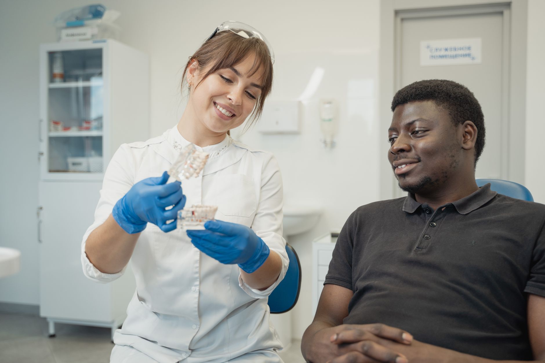 A patient waiting for a consultation to discuss white spots on tonsils.