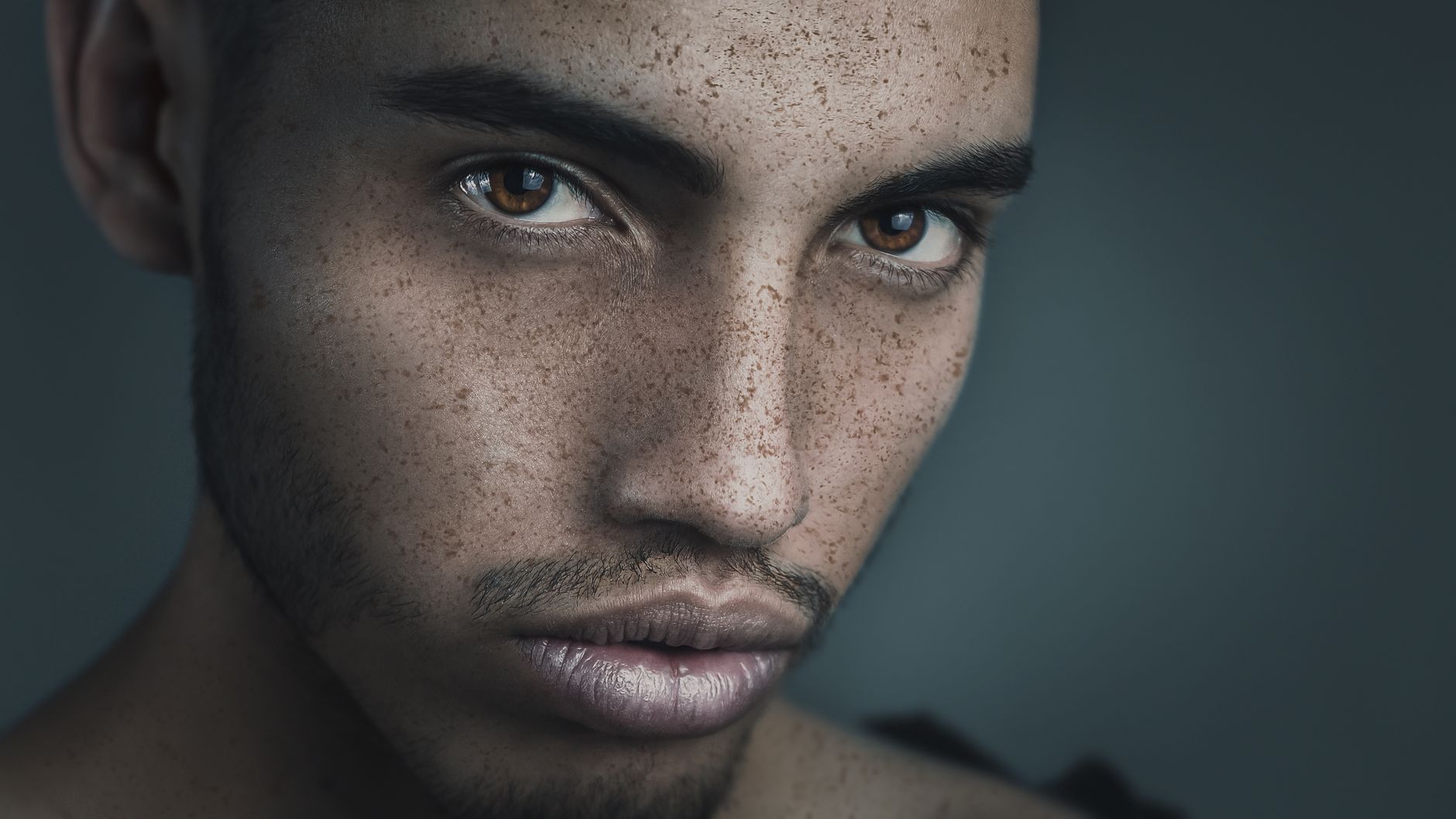 A doctor examining skin during a consultation to address dark spots on face.
