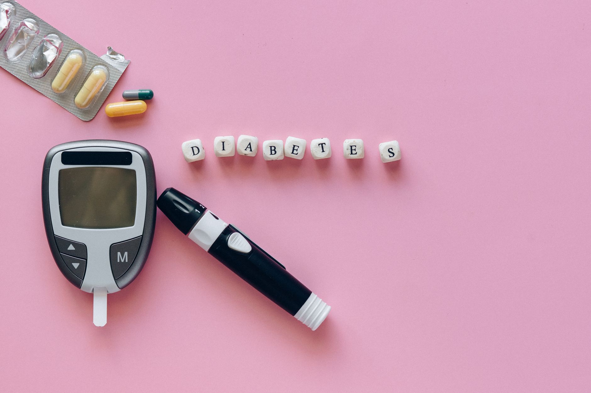 A person checking their blood sugar levels to monitor illness and blood sugar fluctuations.