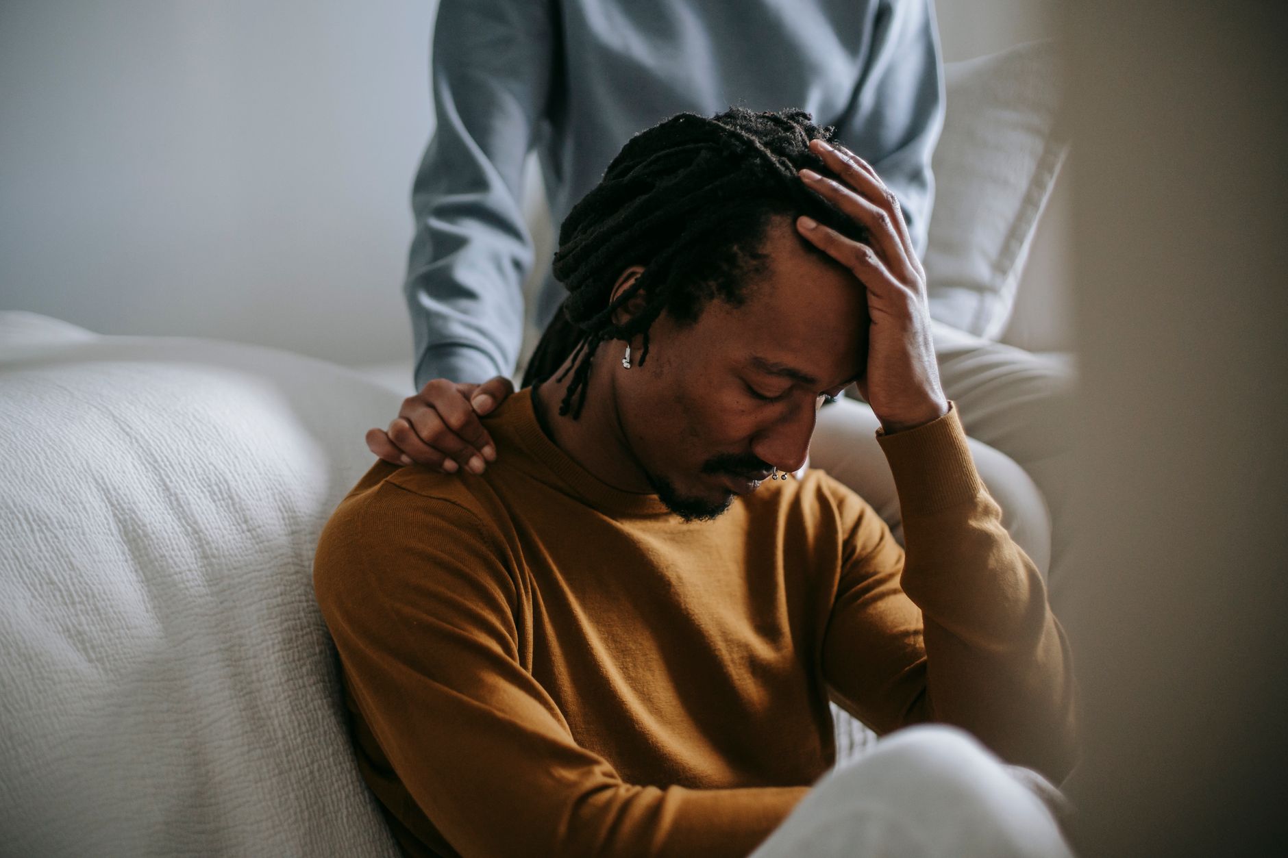 A patient discussing anxiety vs depression symptoms with their doctor in a clinic.