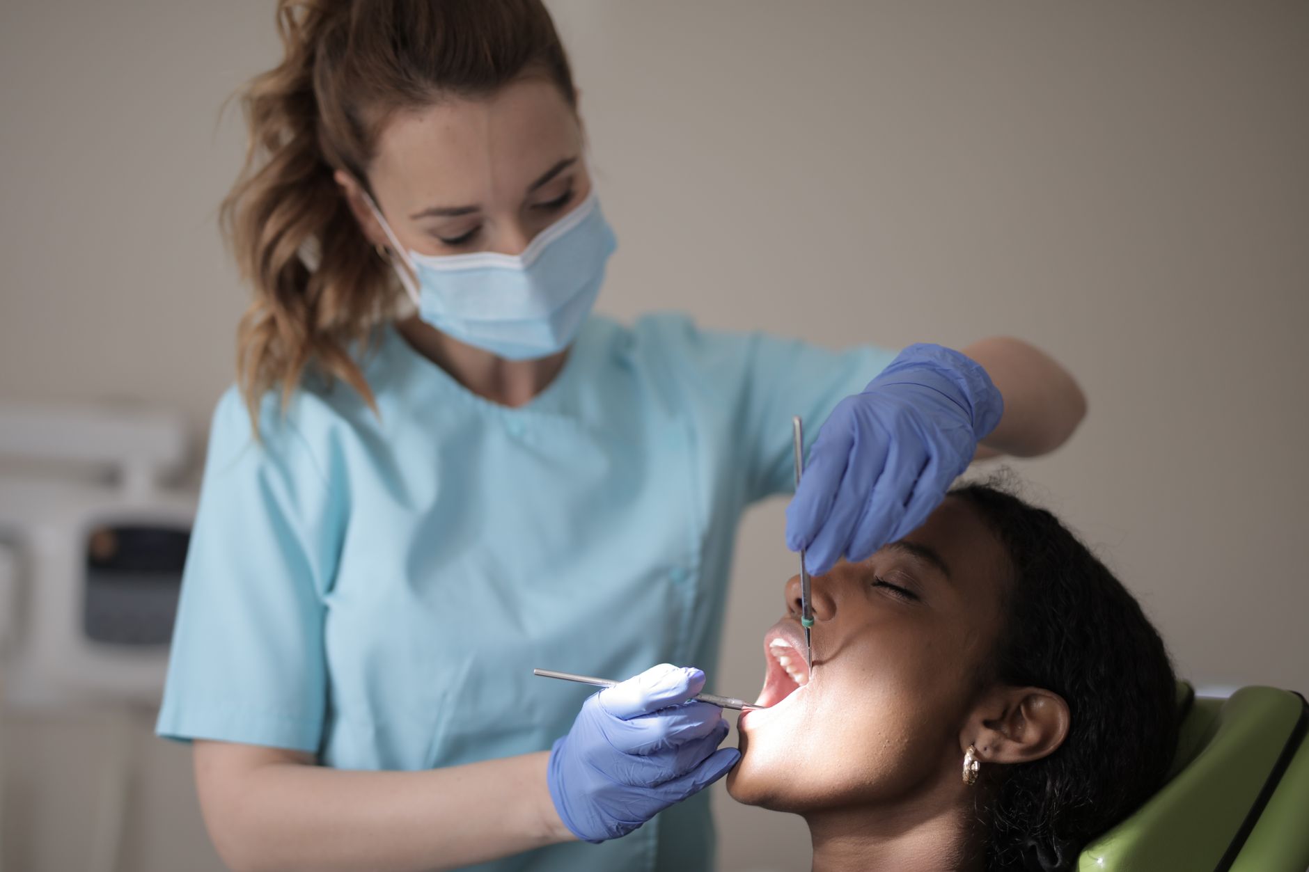 A patient waiting in a medical clinic for urgent care regarding a peritonsillar abscess.
